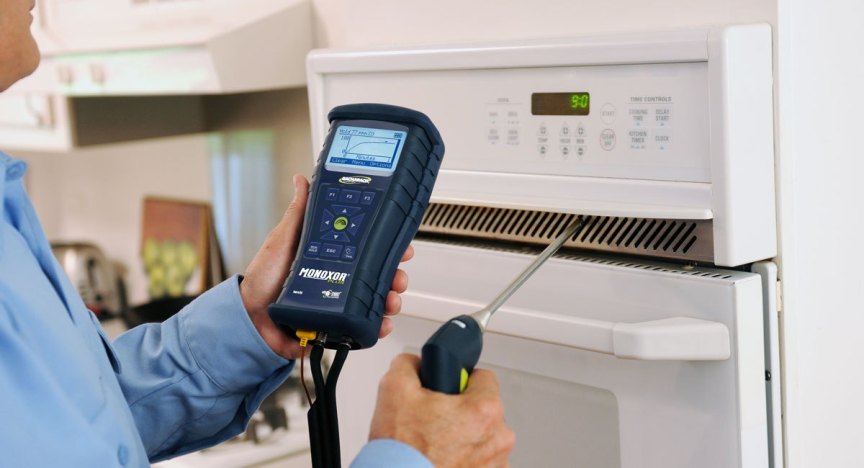Technician testing a home for carbon monoxide