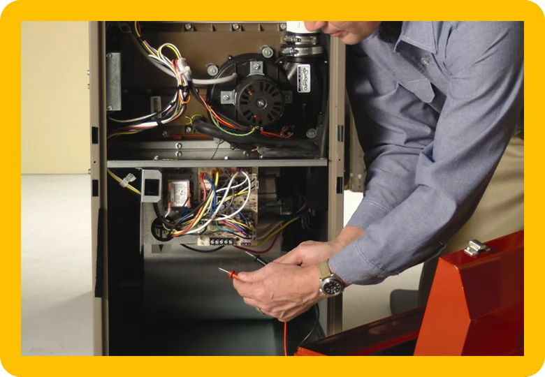 Furnace technician performing diagnostic service