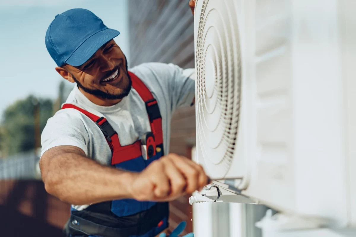 Emergency HVAC technician servicing outdoor equipment