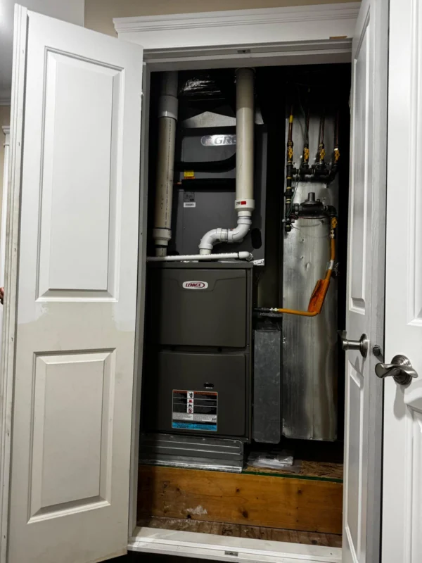 Residential furnace installed inside a utility closet