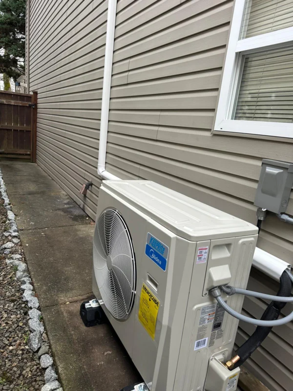 Outdoor heat-pump unit installed beside a home