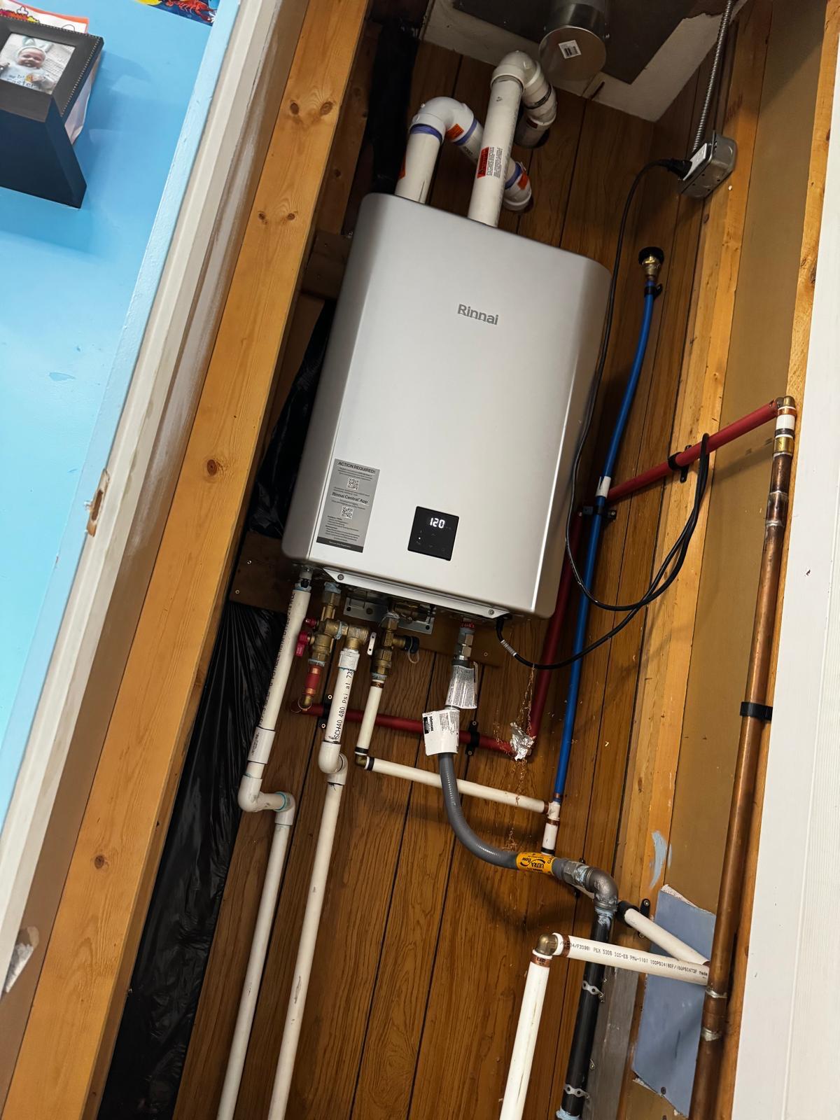 Wall-mounted tankless water heater installation