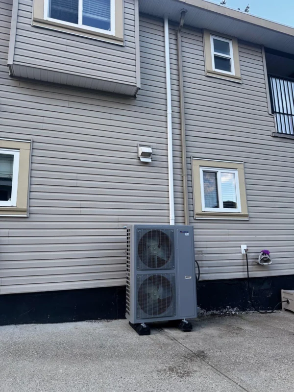 Outdoor heat-pump units beside a residential building