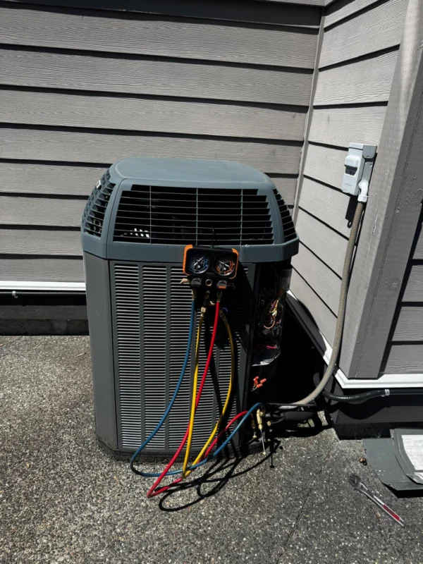 Outdoor heat-pump condenser during service