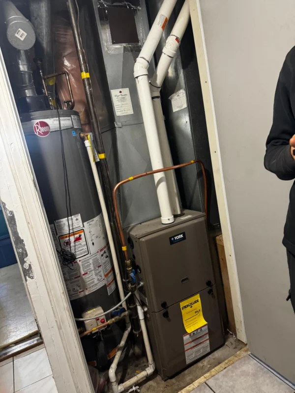 High-efficiency furnace in a utility closet