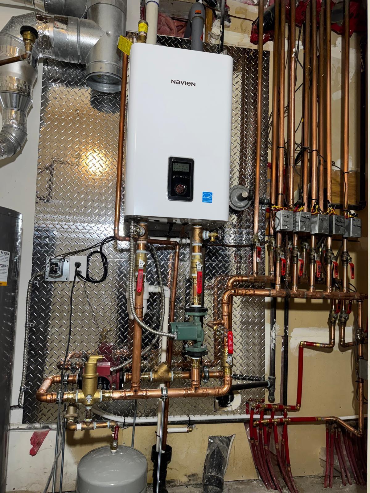 Tankless water heater and hydronic piping installation